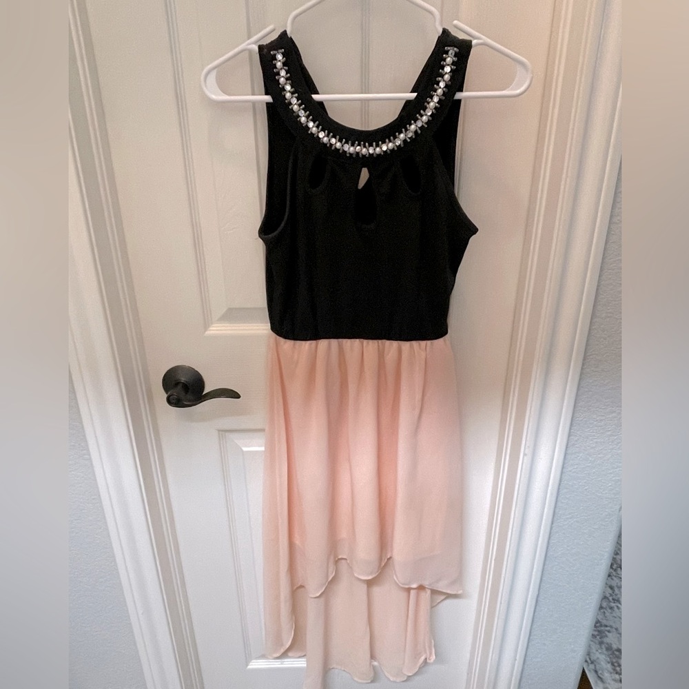 Fit and flow, high low, dress with cut out bodice.